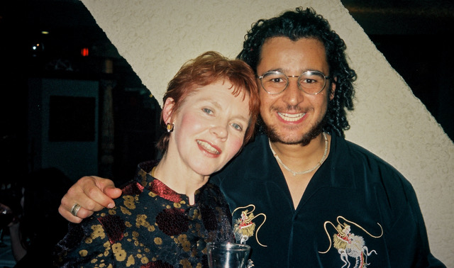 Lee and his mother smiling together at a birthday celebration